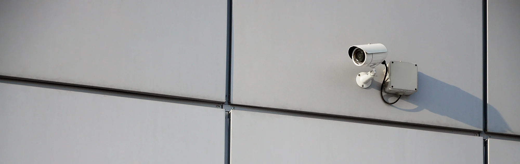 white-surveillance-camera-built-into-the-metal-wal-2022-11-14-16-05-34-utc.webp
